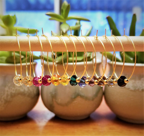 12 swarovski crystal wine glass charms accented with 2mm gold beads