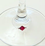 red swarovski crystal wine glass charm accented with 2mm silver beads on silver wire