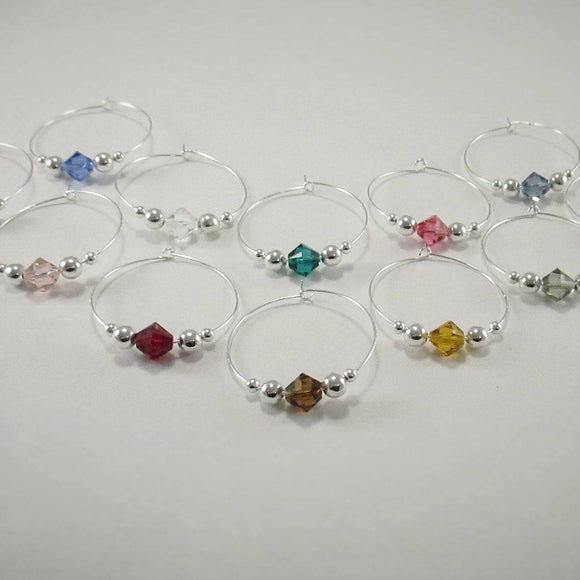 12 swarovski crystal wine glass charms accented with 2mm and 4mm silver beads