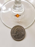 Tangerine swarovski crystal wine glass charm accented with 2mm silver beads on silver wire with quarter